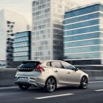 Volvo V40 winter side view from back side on road city background 4k wallpaper
